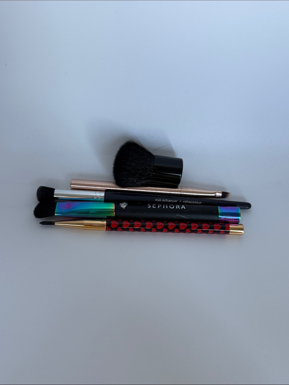 Assorted makeup brushes as is
